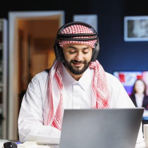 Home arab guy utilizing wireless technology